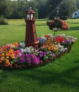 Small decorative building placed in colorful garden bed