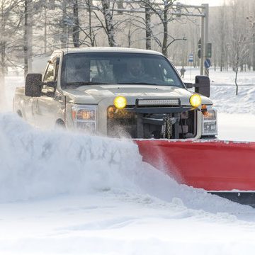 Snow removal from property using a pickup truck