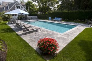 Concrete pool surround in backyard