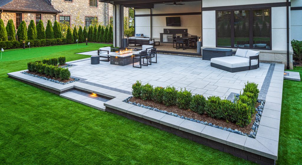 Professional Lawn Care Services by Roseview featuring landscaping and stone patio